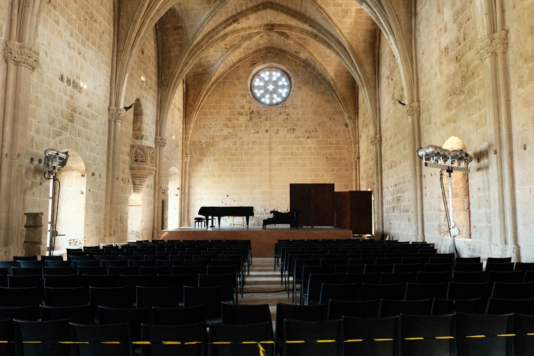 Empty concert hall stage with vintage orchestral instrument cases