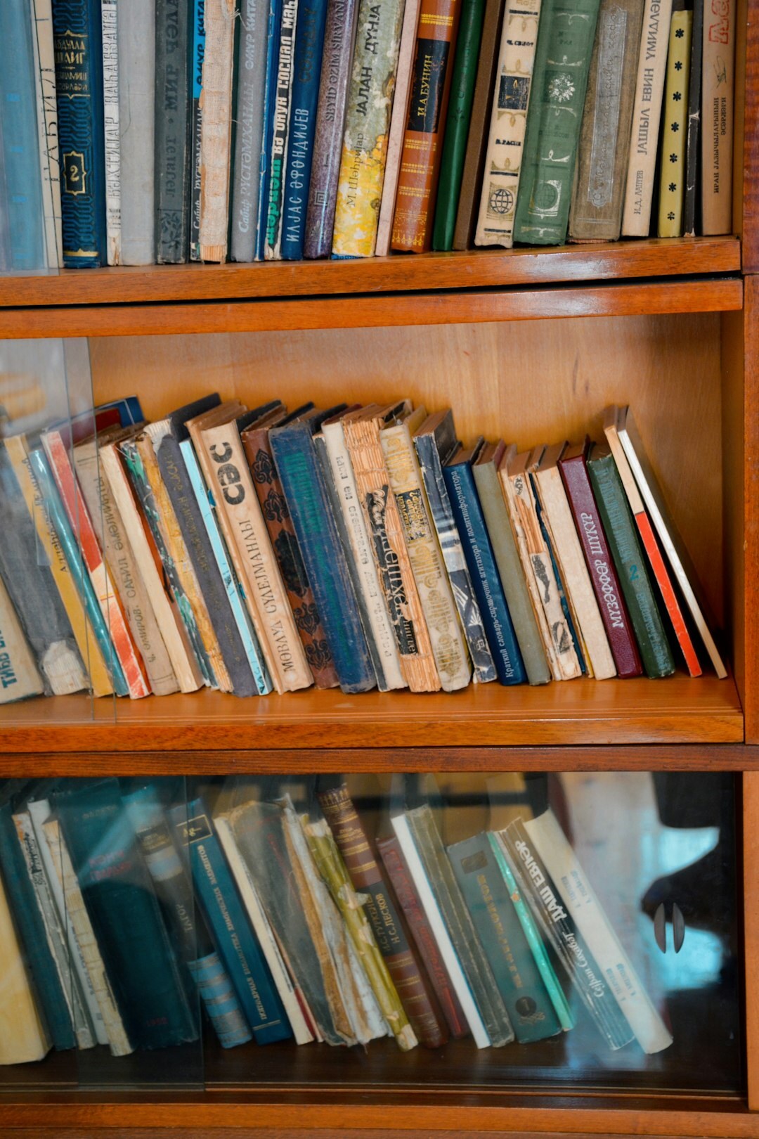 Stacked vintage magazines and bound periodicals on an archive shelf