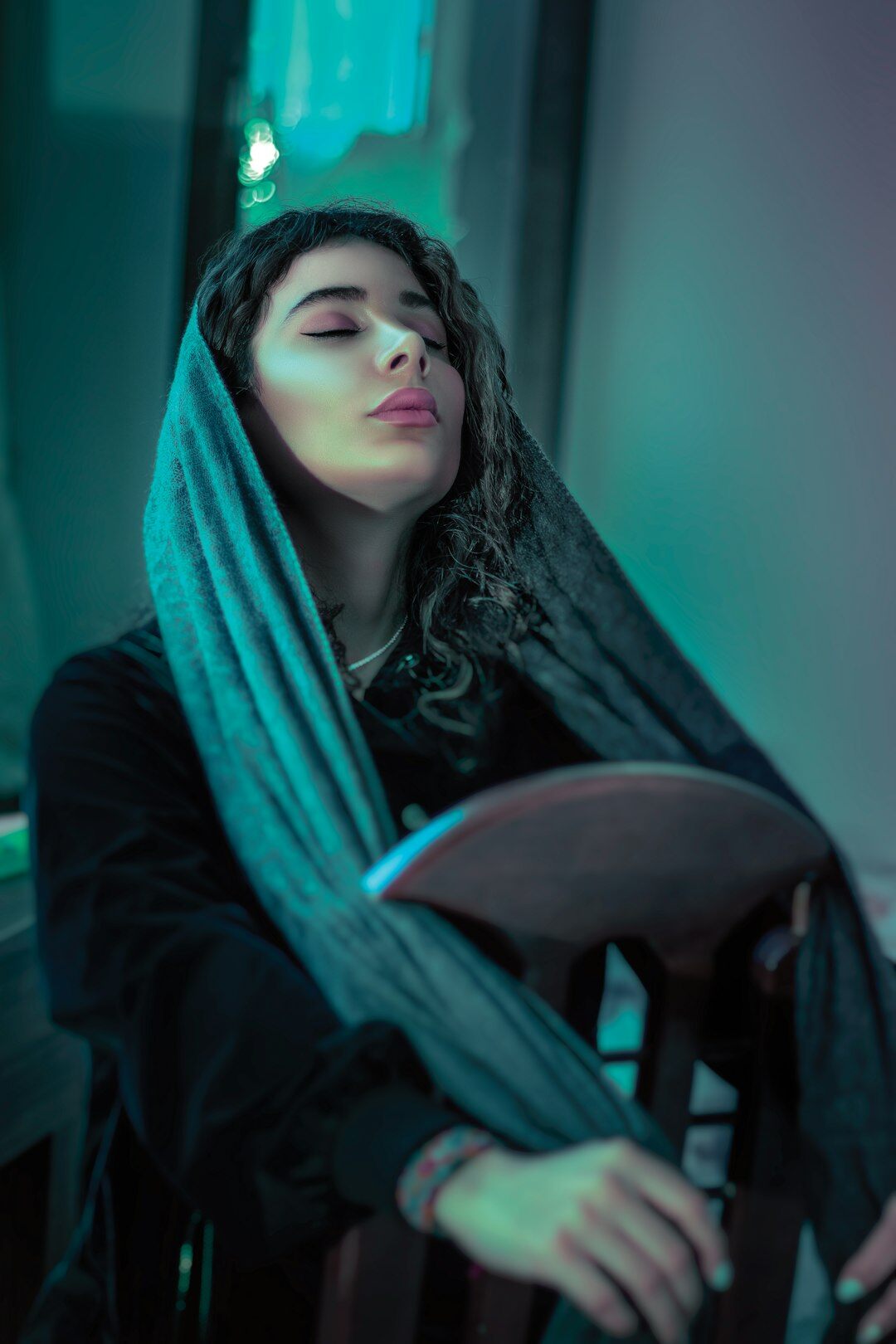 Elegant studio portrait of a Dutch woman in vintage couture with soft dramatic lighting