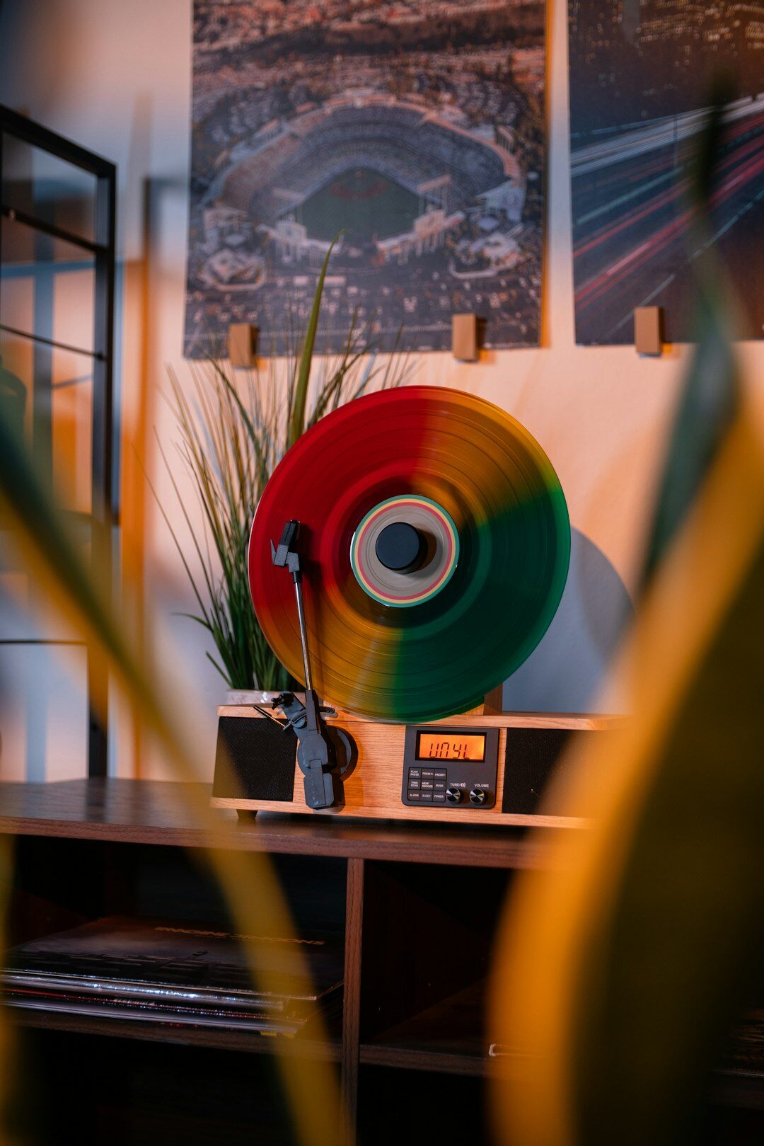 Curated collection of vintage vinyl records and a turntable in warm light